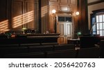 Small photo of Empty American Style Courtroom. Supreme Court of Law and Justice Trial Stand. Courthouse Before Civil Case Hearing Starts. Grand Wooden Interior with Judge's Bench, Defendant's and Plaintiff's Tables.