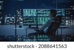 Small photo of Financial Analyst Working on Computer with Multi-Monitor Workstation with Real-Time Stocks, Commodities and Exchange Market Charts. Businessman Deliberating on Next Investment Trade in a Bank Office.
