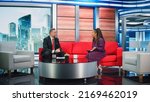 Small photo of Talk Show TV Program Ending, News Interview, Discussion: Presenter and Guest Talk. Cable Channel Hosts Saying Goodbye to the Audience. Mock-up Television Studio, Newsroom Entertainment Concept