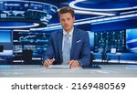 Small photo of Beginning Evening News TV Program: Anchor Presenter Reporting on Business, Economy, Science, Politics. Television Cable Channel Anchorman Talks. Broadcast Network Newsroom Studio Concept.