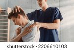 Small photo of Young and Promising Male Athlete Undergoing Physiotherapy, Professional Sport Masseur Treating Light Neck Injury. Musculoskeletal Pain Therapy and Rehabilitation Concept.