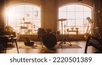 Small photo of Establishing Shot: Music Rehearsal Studio in Loft Room with Drum Set in the Middle. Stylish Interior with Two Big Windows, Cozy Sofa, Shelves and Plants. Sunny Bright Day and Urban View.