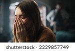 Small photo of Portrait of Sad Crying Woman being Harrased and Bullied by Her Partner. Couple Arguing and Fighting Violently. Domestic Violence and Emotional Abuse. Rack Focus with Boyfriend Screaming in Background