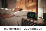 Small photo of Man Wakes Up and Turns off Alarm Clock. Early Rising Productive Man Ready Start a Day full of New Business Projects, Adventures. Focus on Clock Showing Six O'Clock. Sun is Shining. bedroom Apartment