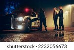 Small photo of Two Police Officers Arrest Suspect, Put Him in the Backseat of Patrol Сar. Officers of the Law Detain, Handcuff Criminal. Cops Arresting Felon, Fight Crime. Cinematic Documentary