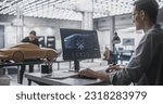 Small photo of Automotive Designer and Modeler Working as a Team on Creating a Futuristic Car in a Studio. Engineer Working on Digital Render on Desktop Computer, Female Sculptor Creating 3D Clay Model