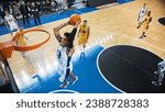 Small photo of Cinematic College Basketball Tournament: Two Young Successful Diverse Teams Play a Championship Match in a Modern Arena. Excited African Player Scores a Perfect Slam Dunk with Two Hands.