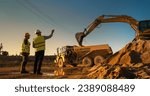 Small photo of Caucasian Male Real Estate Investor And Civil Engineer Talking On Construction Site Of Apartment Block. Colleagues Discussing Building Progress. Excavator Loading Sand In Industrial Truck On Warm Day