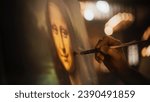 Small photo of Close Up on Male Painter Hand Painting the Mona Lisa with Gentle Brush Movement. Details of the Famous Painting Being Drawn by its Creator. Pure Talent and Mastery of High Art, Everlasting Beauty