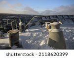 Small photo of snow covered machineries at forecastle deck of a ship in winter