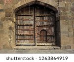 Old Wooden Door With Some Small ...