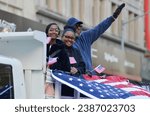 Small photo of Parade marchers holding flags on a parade float during the Annual Veterans Day Parade along 5th Avenue in New York City on Nov 11, 2023.