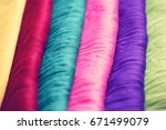 stack of colorful clothes | Shutterstock . vector #671499079