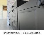 Black handles vintage style on black kitchen wooden cabinets 