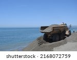 Truck Unloading Sand In Works...