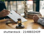 Small photo of concept of litigation and justice Attorneys work with legal advisors. Punishing the defendant in the courtroom Businessman and male lawyer talking with client in office