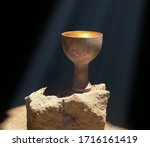 Small photo of Holy Grail Sitting on a Rock