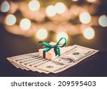 Gift box and US dollar bills. Toned picture