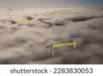 Small photo of Aerial view of Samson and Goliath Cranes in heavy fog at Harland and Wolff Shipyard Dockyard where RMS Titanic was built at Titanic Quarter Belfast Northern Ireland 03-03-23