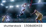 Small photo of Basketball players on big professional arena during the game. Basketball player makes slam dunk. Bottom view