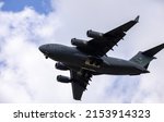 Small photo of SAN ANTONIO, TEXAS - 04.23.2022 - USA Air Force Boeing C-17 Globemaster III military cargo plane in flight. Aircraft of the 62nd Airlift Wing.