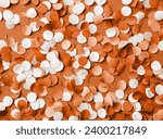 Color of the year 2024: Peach Fuzz. 4th of July American Independence Day, colorful circle shape confetti from shredded paper , decorations for fourth july