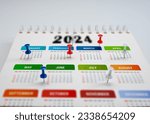 Small photo of Calendar 2024 planning. colorful pin marks important dates. 2024 Planner calendar, clock to set timetable organize schedule, planning for business meeting, planning concept.