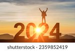 Small photo of 2024. New Year 2024. Man standing at top of data 2024 as sun begins to set. Success Business Leadership. Goals, hopes and aspirations concept. Male silhouette on sunrise background