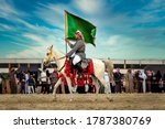 Small photo of Saudi Arab Horse rider with Saudi Arabia national flag on traditional desert safari festival in abqaiq Saudi Arabia. 10-Jan-2020