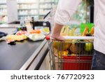 Man buying food products in the supermarket shopping