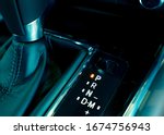 Automatic car gear stick. Automatic transmission gear shift inside modern and sport design car. Gear stick shift on parking mode position. Park-transmission locked in position for parking. Automotive.