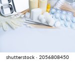 Small photo of Wound care dressing set. Medical supply for diabetes, surgical and accidental wounds care. Medical equipment for nurse. Forceps, cotton stick, conform bandage, povidone-iodine bottle and latex gloves.