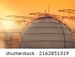 Small photo of Selective focus on industrial gas storage tank. LNG or liquefied natural gas storage tank. Natural gas storage industry and global market consumption. Global energy crisis concept.