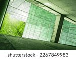 Small photo of Sustainble green building. Eco-friendly building. Sustainable glass office building with tree for reducing carbon dioxide. Office with green environment. Corporate building reduce CO2. Safety glass.