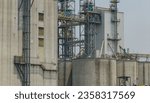 Small photo of Animal feed factory. Agricultural silos, grain storage silos. Agriculture industry. Rural agribusiness. Grain storage innovation. Agricultural silos at animal feed factory. Sustainable farming.