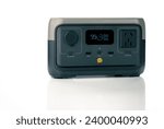 Small photo of Portable power station or power box isolated on white background. On-the-Go energy solution. Power supply for outdoor adventure. Compact portable power box with a rechargeable lithium-ion battery.
