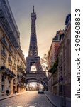 Small photo of Paris, France - January 20, 2021: A back alley in Paris showcasing the architecture of the buildings with the Eiffel Tower in the background