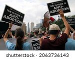Small photo of Austin, TX, USA-Oct. 2, 2021: Pro-life counter protesters at the Women's March pro-choice rally at the Capitol support Texas' abortion law that effectively bans abortions after six weeks of pregnancy.