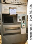 Small photo of Treforest, Pontypridd, Wales - February 2018: A self service ticket machine on the platform of a railway station with an "out of order" notice on the front