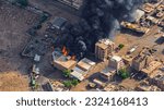 Small photo of Aerial photos dated June 28, 2023 of a huge fire in one of the buildings in the city of Omdurman due to violent clashes between the Rapid Support Forces and the Central Reserve