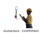 Small photo of Authorise auditor personal wearing side impact safety helmet standing holding paperwork pen conducting safety inspecting an inertial reel fall arrest, fall restraint equipment