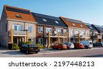 Small photo of Newly build houses with solar panels attached on the roof against a sunny sky Close up of a new building with black solar panels. Zonnepanelen, Zonne energie, Translation: Solar panel, , Sun Energy.