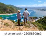 Small photo of lagoon of Knysna, South Africa. beach in Knysna, Western Cape, South Africa. A couple of men and a woman on a road trip at the garden route in South Africa