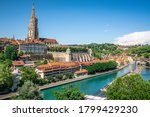 Scenic Bern old town cityscape with old buildings Bern Minster cathedral tower and Aare river view in Bern Switzerland