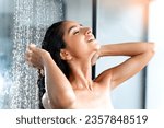 Showering and bathing with beautiful Indian woman taking shower in morning