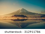 Mount fuji san at Lake kawaguchiko in japan on sunrise.  vintage tone 