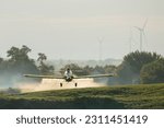 Small photo of Air Tractor 802 airplane spraying fungicide on a soybean field in the Midwest. This airplane carries a payload of 800 gallons in the hopper.