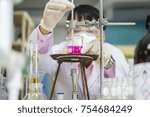 Small photo of Scientists are watching the temperature in the thermomist to find the melting point of the chemical in the laboratory.