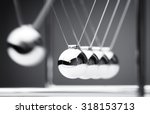 Small photo of Newton's cradle physics concept for action and reaction or cause and effect