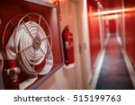 Fire extinguisher and fire hose reel in hotel corridor